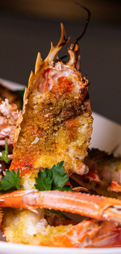 Grilled Mozambique sea crayfish with fruit wood charcoal and vanilla breadcrumbs