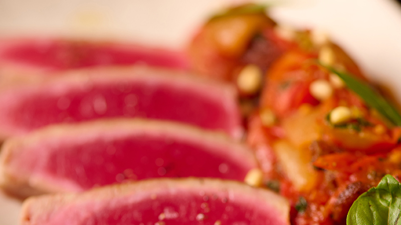 Tender fried yellowfin tuna (150g) paired with Sicilian stewed eggplant