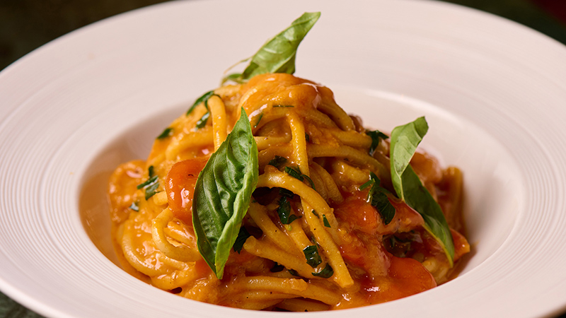 Freshly made spaghetti with sea urchin, garlic, basil juice, and chili peppers