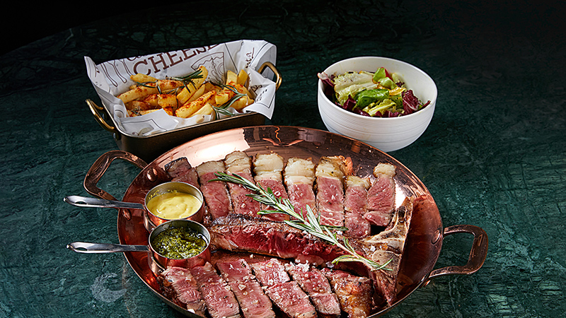 Grilled Australian Wagyu M6_7 T-bone steak (1.2kg) with vegetable salad, country fries, and homemade green sauce