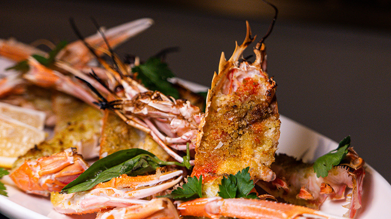 Grilled Mozambique sea crayfish with fruit wood charcoal and vanilla breadcrumbs