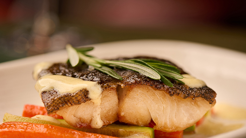 Grilled black cod with stir fried vegetables and Dutch sauce